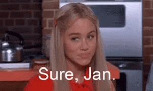 A blonde woman smiling sceptically, saying "Sure, Jan".